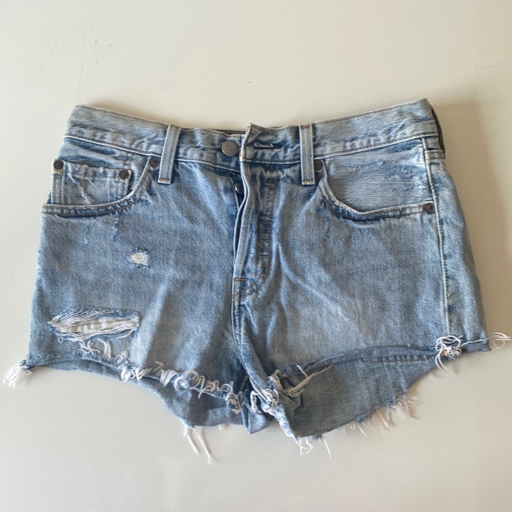 Levi’s 501 light wash distressed denim shorts